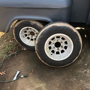 15x8 vintage wheels with tires.